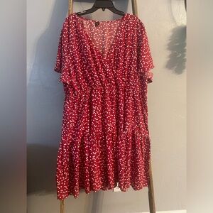 Red tiered dress with small white hearts. Faux front cross-over style.